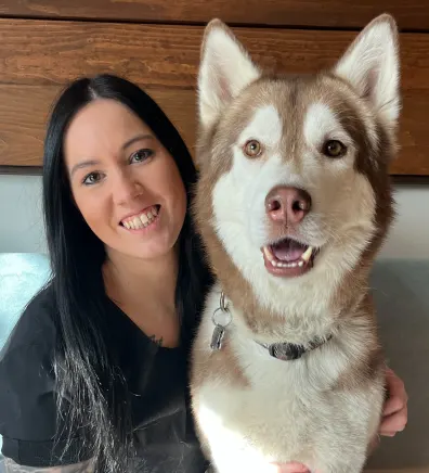 Cassie, staff at Rose Valley Veterinary Hospital, with husky